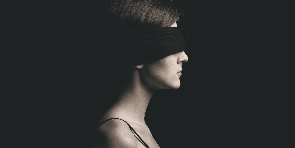 Bias: woman wearing a blindfold