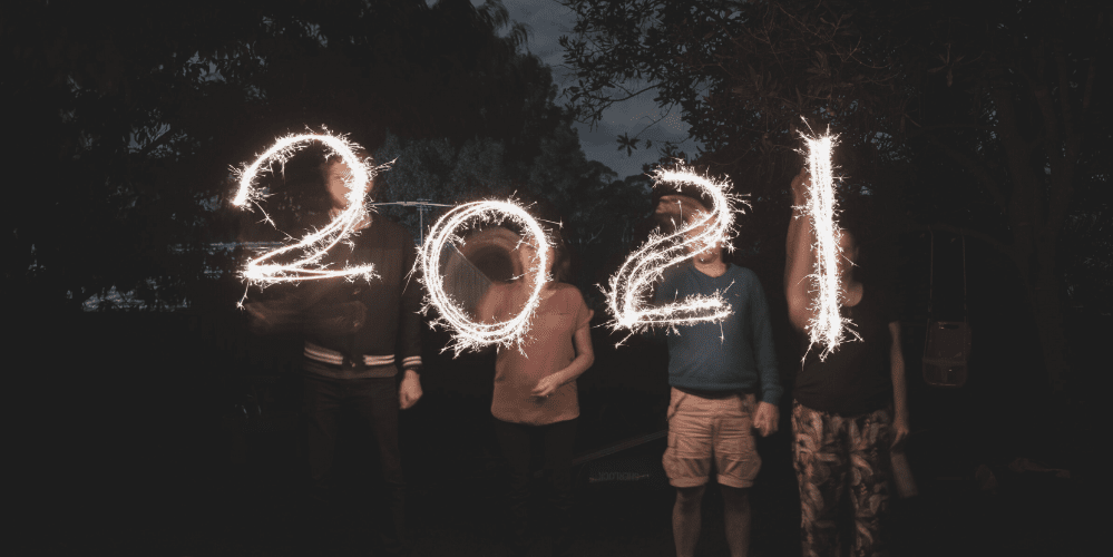 Family with sparklers spelling 2021